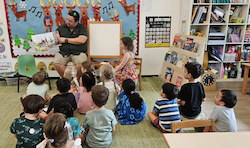 The busy bees enjoyed listening to Andrew, our mystery reader.
