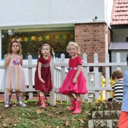 The girls are having a great time flying the planes with great amount of focus .