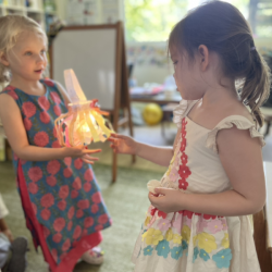 Vivi admiring Regan’s lantern for her show and tell.