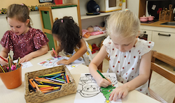Vivi,Reina and Regan enjoying their Christmas colouring activity.