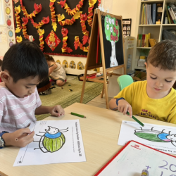 Enzo and Finley working on their addition activity.