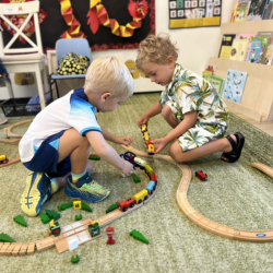 Kalle and Rowan having fun playing with the trains.