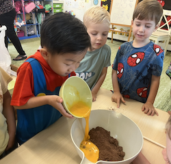 Lincoln enjoying the process of making muffins.