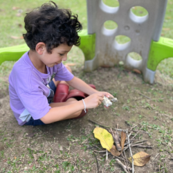 Luca starting a campfire .