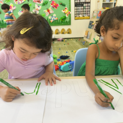 Myla and Reina focusing on their colouring.