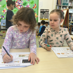 Paige and Vivi completing their numeracy activity.