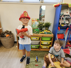 Rowan having a great time with pretend play.