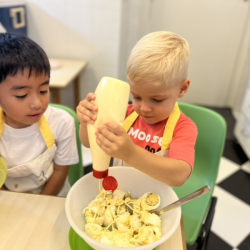 Rowan having fun making egg salad. 