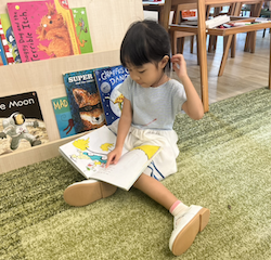 Toria enjoying her reading time .