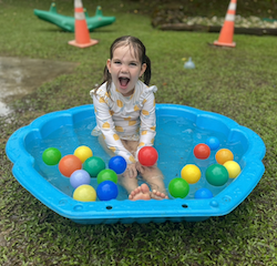 Vivi having fun pretending to be a mermaid