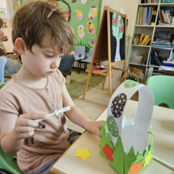 Wilbur creating a beautiful Easter egg basket