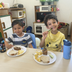 Alex and Luca enjoying some yummy party snacks