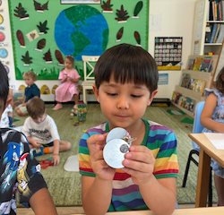 Alex experimenting with magnets.
