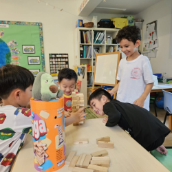 Boys having fun with the game of Jenga.