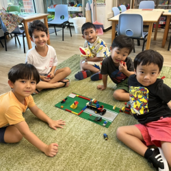 Boys having fun with Lego play .