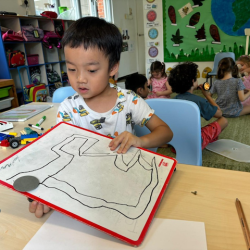 Ei having fun experimenting with magnets.