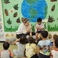 Enzo sharing about his wonderful drawing in his notebook.