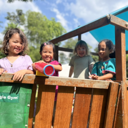 Girls having fun at the pirate ship, looking for treasure.