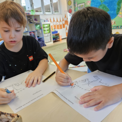 Javin and Wilbur enjoying numeracy activity.