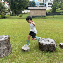 Javin having fun jumping and balancing on the logs.