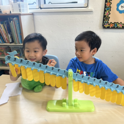 Lincoln and Ei enjoying balancing game.