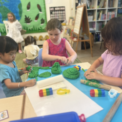Paige and Rowan exploring nature by tree bark rubbing. .