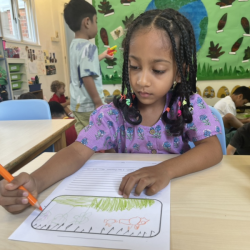 Reina focusing on her journal writing .