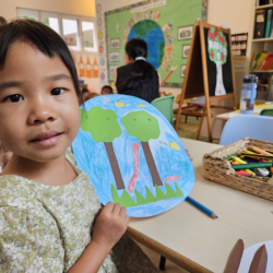 Toria happy with her rainforest collage masterpiece. 