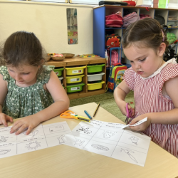 Vivi and Paige having fun with reading activity.