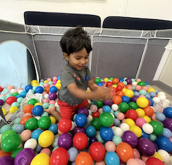 Aarav enjoying the ball pit!