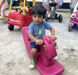 Aarav enjoying the rocking horse!