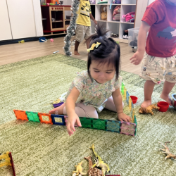 Ellie enjoying the magnetic tiles!