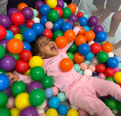 Imaan enjoying the ball-pit!