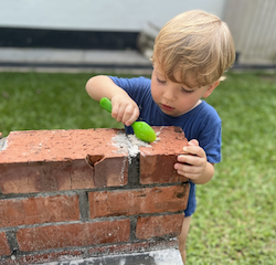 Leo practicing his cementing skills!