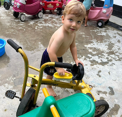 Leo washing the bikes!
