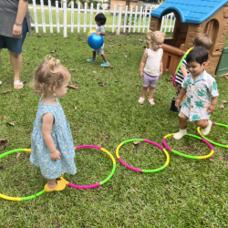 Milan and Indie jumping in and out of the hula hoops