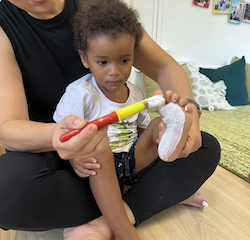 Teddy getting his foot painted.