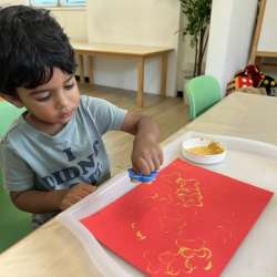Aarav painting his lantern!