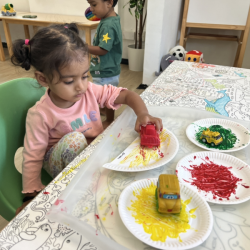Imaan painting using cars.