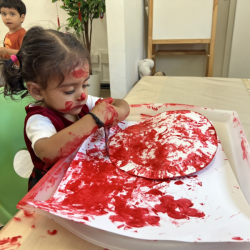 Imaan painting with the colour red!