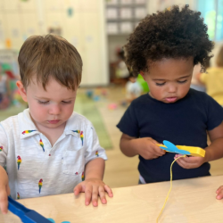 Luca and Amara exploring the magnetic butterflies!
