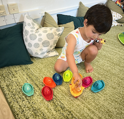 Milan playing with the boats!