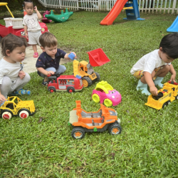Otto, Luca and Milan enjoying playing with the diggers!.png