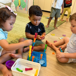 Alba, Kavi and Alexander stacking pegs together!