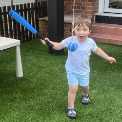 Alexander showing his friends how to hit the ball!