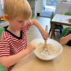 Asher’s helping to mix the flour and making some playdough!