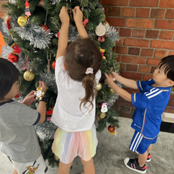 Decorating our Christmas tree with ornaments