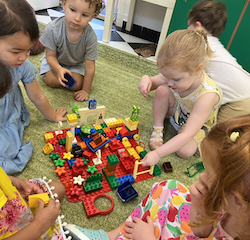 Isabelle explains to her friends what is in her Flowers Lego house!