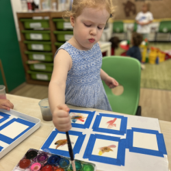 Isabelle is painting Christmas cards