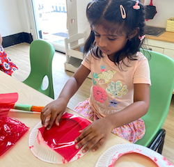 Kaavya sticking cellophane paper for her lantern!